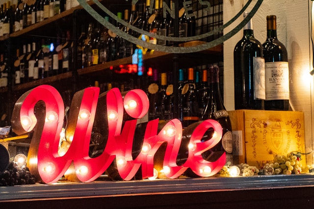 wine sign with wine bottles