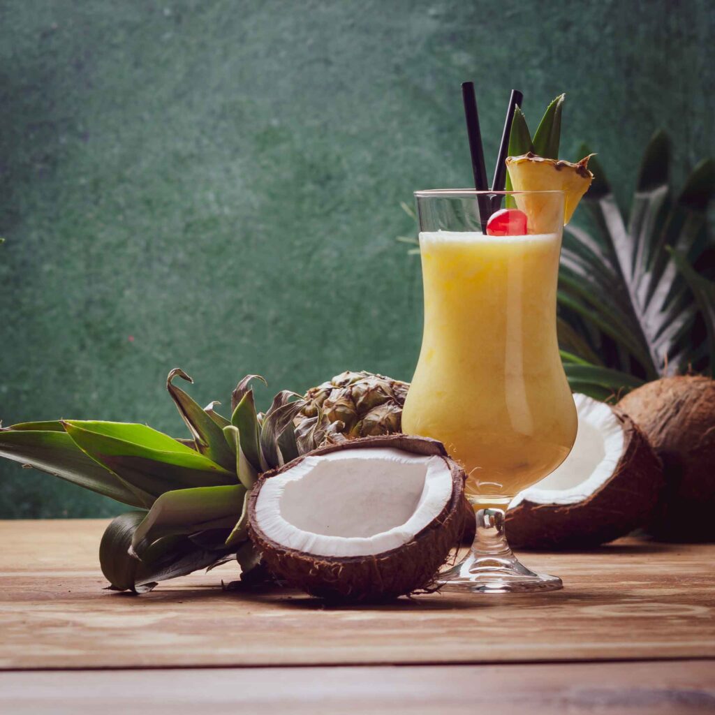 spiced pina colada drink with a coconut