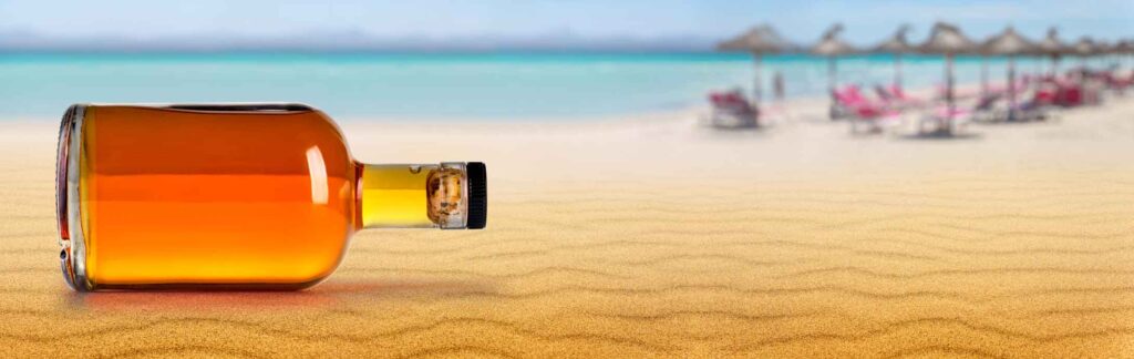 rum bottle on the beach