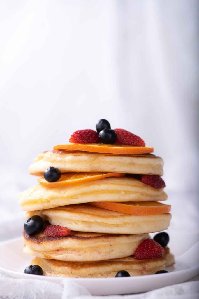 Stack of pancakes with fresh berries - Best Breakfast Sanibel
