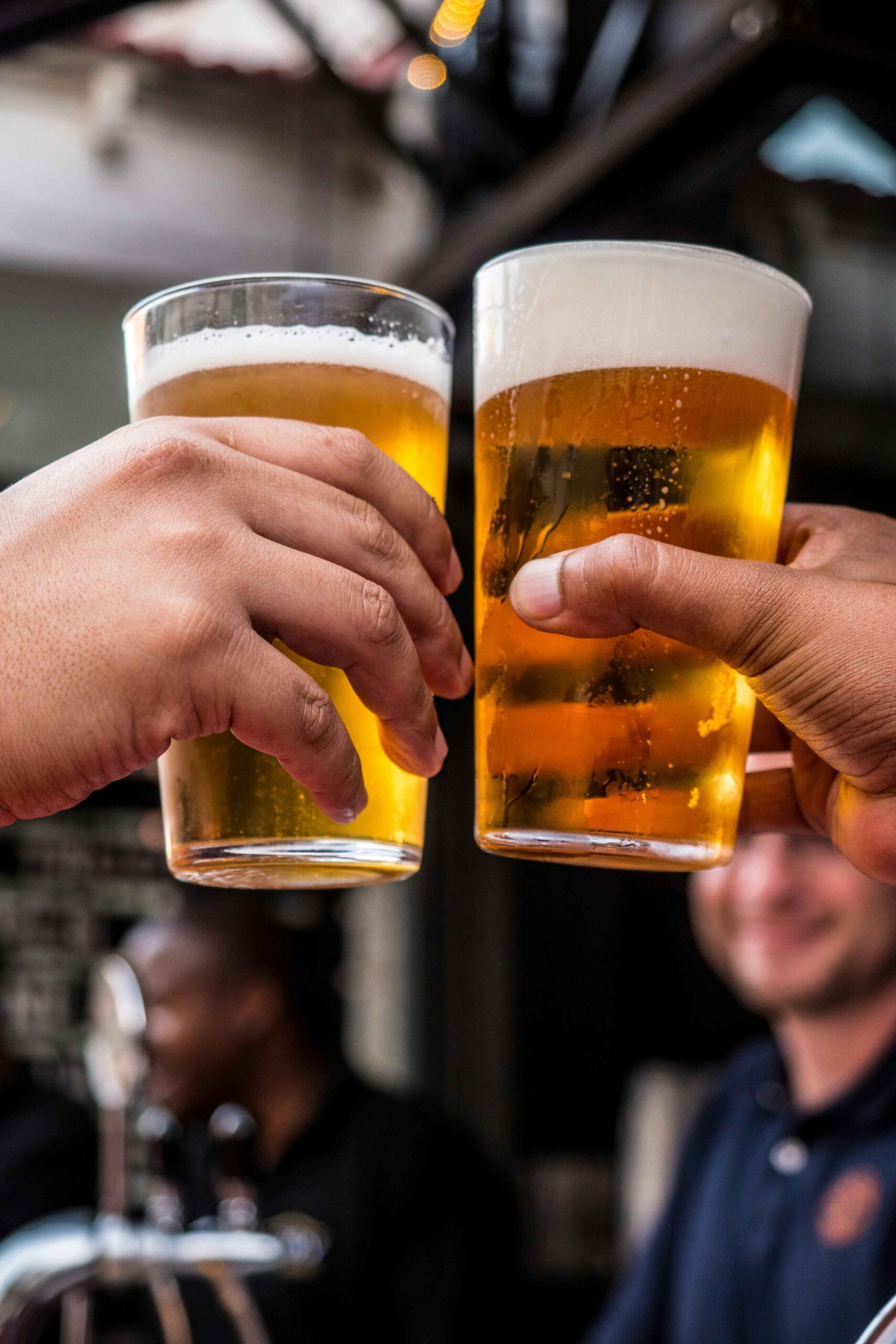 Two people toasting two glasses of beer. Breweries in Hagerstown, MD